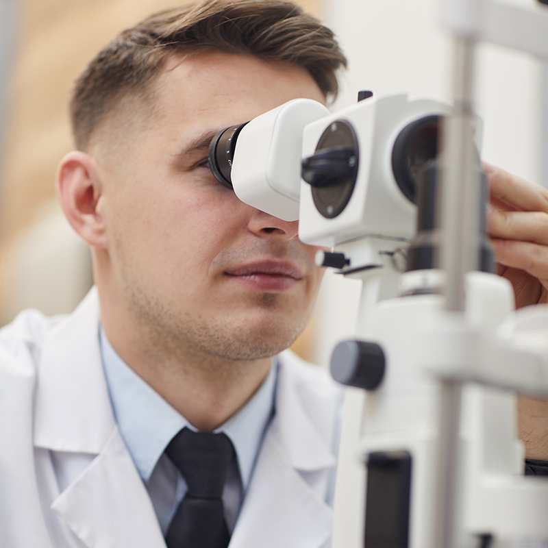 Ophthalmologist using vision test equipment to evaluate Pterygium in Las Vegas