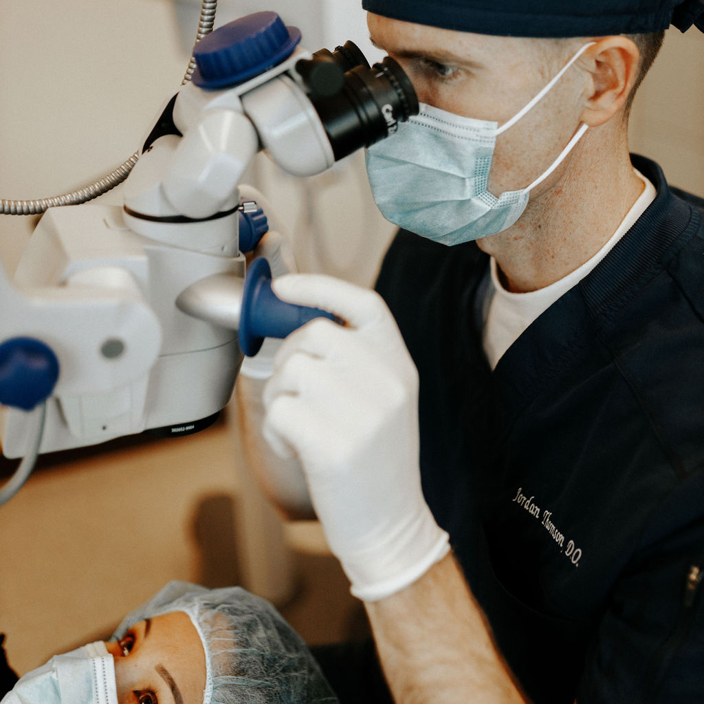 Jordan Thomson Eye Surgeon in Las Vegas checking a patient's eyes