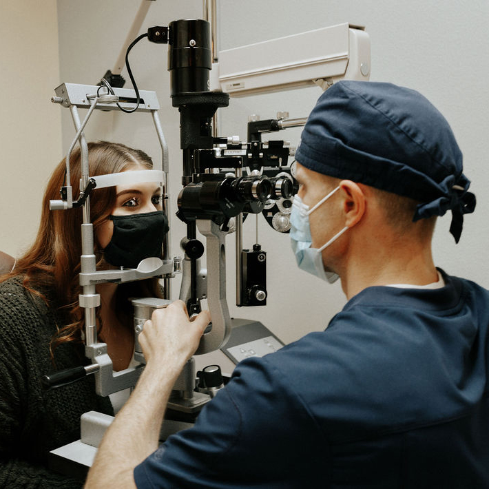 Jordan Thomson Las Vegas Eye Surgeon examining a patient's eyes