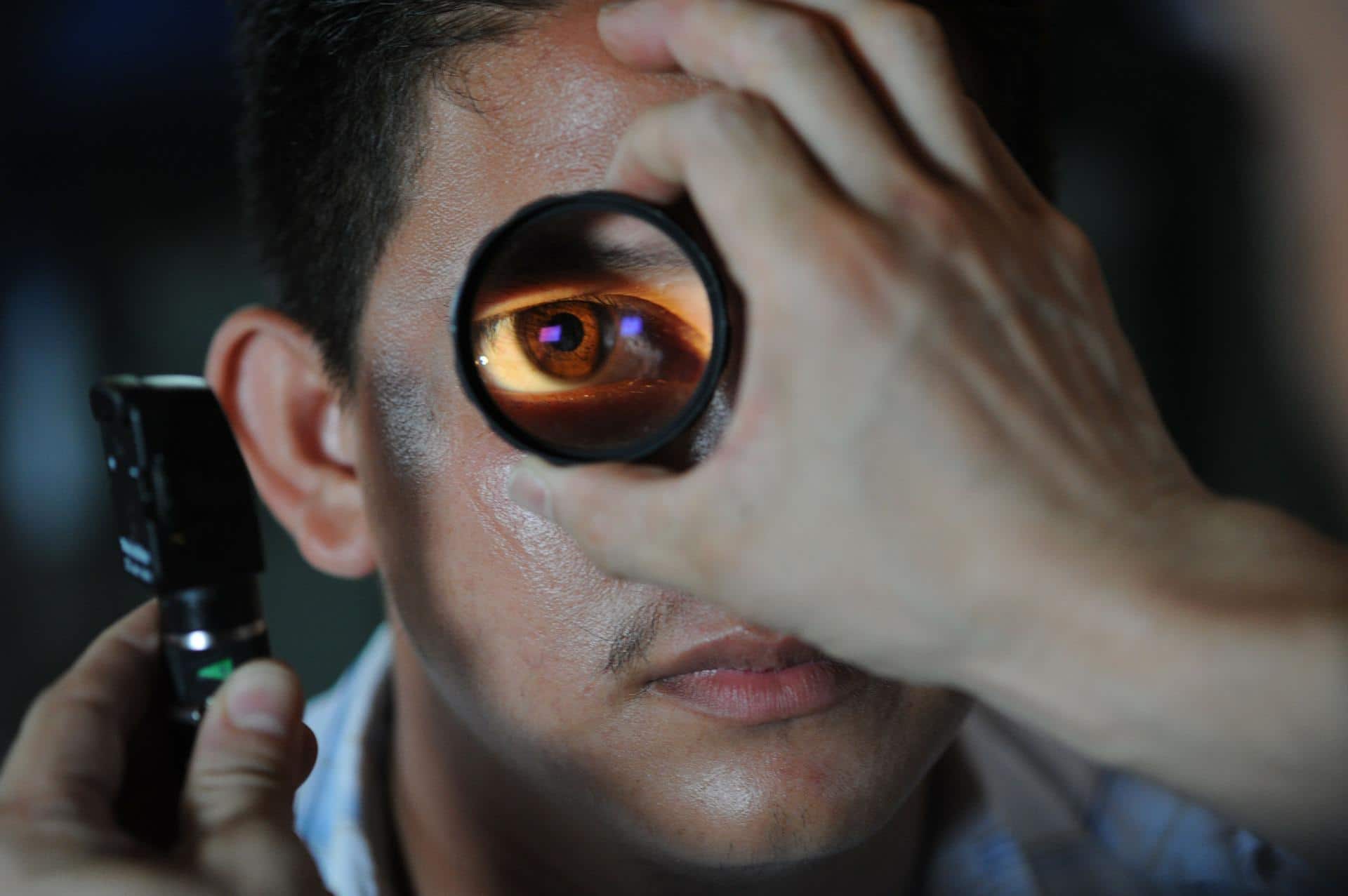 A patient being checked on his eye