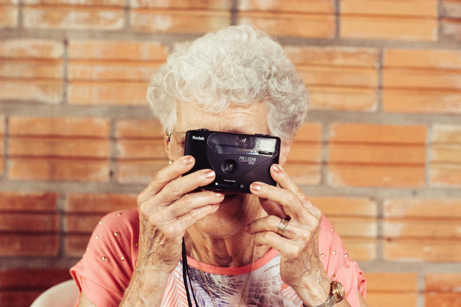 An elderly lady with camera