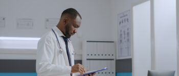 Specialist doctor checking patient report documents