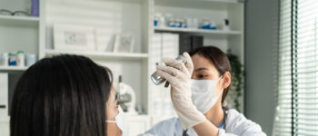 Las Vegas eye doctor examining patient for thyroid-related eye diseases