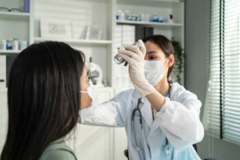 Las Vegas eye doctor examining patient for thyroid-related eye diseases